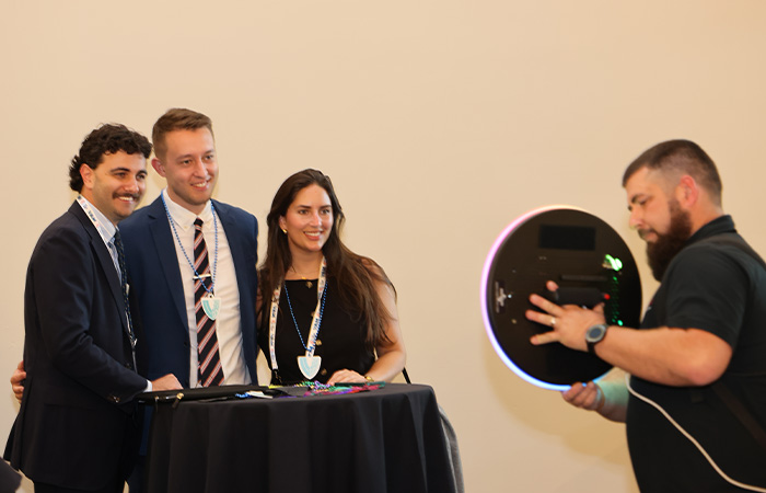 SVS Connect people posing for a photobooth photograph