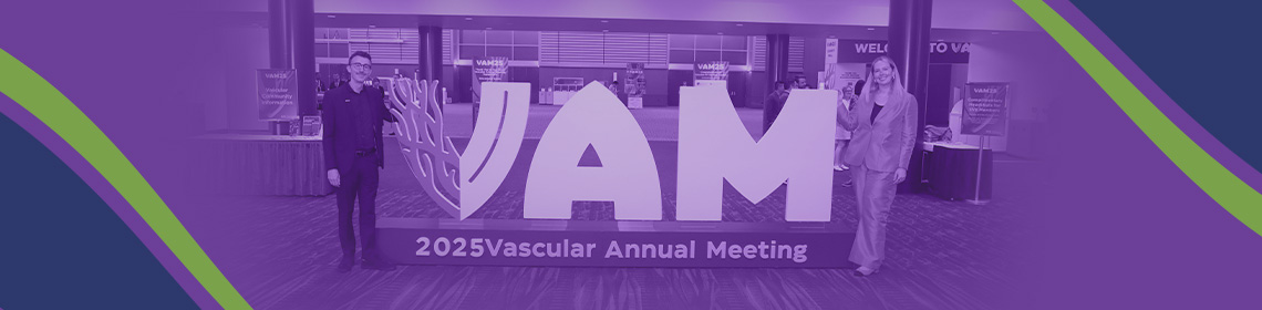 People Standing by VAM Sign